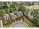 Aerial view of a well-maintained home with lush landscaping and a circular driveway in a serene neighborhood at 10731 Bossier Dr, Alpharetta, GA 30022