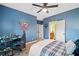 Teen's bedroom showcasing colorful decor, desk, and comfortable bed, designed for relaxation and study at 10731 Bossier Dr, Alpharetta, GA 30022