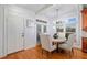 Bright breakfast area with wood floors, natural light, and access to the kitchen at 10731 Bossier Dr, Alpharetta, GA 30022