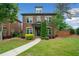 Beautiful two-story brick home with manicured lawn and welcoming front porch at 10731 Bossier Dr, Alpharetta, GA 30022