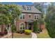 Charming brick home with lush landscaping and a welcoming facade at 10731 Bossier Dr, Alpharetta, GA 30022