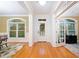 Bright foyer with hardwood floors, large windows, and decorative rug at 10731 Bossier Dr, Alpharetta, GA 30022