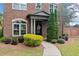 Inviting front porch with well-maintained landscaping and a decorative wreath at 10731 Bossier Dr, Alpharetta, GA 30022