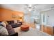 Spacious living room with hard wood floors, area rug, and large comfortable couch at 10731 Bossier Dr, Alpharetta, GA 30022