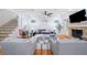 Cozy living room with a fireplace, comfortable seating, and access to staircase at 10731 Bossier Dr, Alpharetta, GA 30022