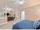 Open main bedroom space featuring a ceiling fan, pillars, and seating area at 10731 Bossier Dr, Alpharetta, GA 30022