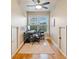 Office space with wood floors, a window with natural light, and white walls at 10731 Bossier Dr, Alpharetta, GA 30022
