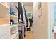 Bright and functional walk-in closet with built-in storage solutions and organized shelving at 10731 Bossier Dr, Alpharetta, GA 30022