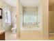 Bathroom with a large soaking tub, separate shower, and tiled floors for a relaxing experience at 885 Falling Water Ln, Norcross, GA 30093