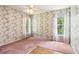 Bedroom showcasing carpet, wallpaper, and a window with curtains at 885 Falling Water Ln, Norcross, GA 30093