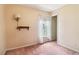 This bedroom features wallpaper and carpet at 885 Falling Water Ln, Norcross, GA 30093