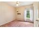 This bedroom features wallpaper and carpet at 885 Falling Water Ln, Norcross, GA 30093
