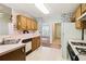 Functional kitchen with essential appliances and ample counter space, connecting to other living areas at 885 Falling Water Ln, Norcross, GA 30093