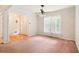 Inviting living room featuring large windows, carpeted floors, and a view of the front entryway at 885 Falling Water Ln, Norcross, GA 30093