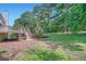 Green backyard and a deck, blending outdoor living with the natural landscape at 3290 Spincaster Way, Loganville, GA 30052