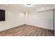 Unfinished basement space featuring new flooring, clean walls, and ample storage at 3290 Spincaster Way, Loganville, GA 30052