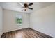 Well-lit bedroom with a window view and modern ceiling fan at 3290 Spincaster Way, Loganville, GA 30052