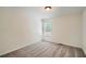 Neutral bedroom with a window overlooking the backyard and soft carpeted floors at 3290 Spincaster Way, Loganville, GA 30052