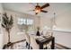 Elegant dining area with stylish lighting, large window, and seating for four at 3290 Spincaster Way, Loganville, GA 30052