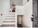Bright entryway with high ceilings and stylish staircase leading to the upper level at 3290 Spincaster Way, Loganville, GA 30052