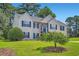 Well-kept home featuring a tidy lawn, blue shutters, and two car garage at 3290 Spincaster Way, Loganville, GA 30052