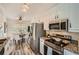 Updated kitchen with stainless steel appliances, granite counters and a dining nook at 3290 Spincaster Way, Loganville, GA 30052