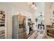 Updated kitchen with stainless steel refrigerator, ample cabinets and a view into the breakfast nook at 3290 Spincaster Way, Loganville, GA 30052