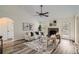 Spacious living room featuring a stone fireplace, hardwood floors, and natural light at 3290 Spincaster Way, Loganville, GA 30052