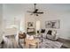 Open-concept living room boasting vaulted ceilings, modern decor, and hardwood floors at 3290 Spincaster Way, Loganville, GA 30052