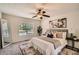 Comfortable main bedroom with plush carpeting, neutral decor, and large windows at 3290 Spincaster Way, Loganville, GA 30052