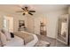 Main bedroom with neutral tones, plush carpeting, and convenient ensuite access at 3290 Spincaster Way, Loganville, GA 30052