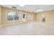 Bright and open basement featuring tile flooring, large windows, and access to an additional room at 4230 Pilgrim Point Rd, Cumming, GA 30041