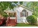 Charming single-story home featuring a bright exterior, front porch, and neatly landscaped yard at 4230 Pilgrim Point Rd, Cumming, GA 30041