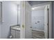 Bathroom next to laundry room with granite countertop at 5380 Rock Place Drive, Stone Mountain, GA 30087