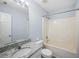 This bathroom offers a shower-tub combo with granite vanity and modern fixtures at 5380 Rock Place Drive, Stone Mountain, GA 30087