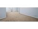 Bedroom featuring neutral carpet, light blue paint, and white trim at 5380 Rock Place Drive, Stone Mountain, GA 30087