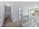 Upstairs hallway with views of foyer, chandelier, and a bedroom entrance at 5380 Rock Place Drive, Stone Mountain, GA 30087
