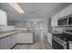 Well-lit kitchen with granite countertops, stainless appliances and an eat-in nook at 5380 Rock Place Drive, Stone Mountain, GA 30087