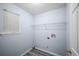 Functional laundry room with shelf and connection hookups at 5380 Rock Place Drive, Stone Mountain, GA 30087