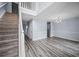 Open-plan living area with stairs and lots of natural light at 5380 Rock Place Drive, Stone Mountain, GA 30087