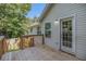 Home with wooden deck overlooking the lush green backyard offers a private retreat at 6797 Braswell Mountain Rd, Rockmart, GA 30153