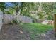 A fenced backyard with a green lawn at 6797 Braswell Mountain Rd, Rockmart, GA 30153