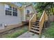 Home with a wooden deck and steps leading to a landscaped backyard at 6797 Braswell Mountain Rd, Rockmart, GA 30153
