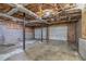 Unfinished basement with exposed ceiling and concrete floor, great for storage and customization at 6797 Braswell Mountain Rd, Rockmart, GA 30153