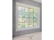 Bathroom window with decorative glass design at 6797 Braswell Mountain Rd, Rockmart, GA 30153