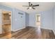 Bedroom boasts hardwood floors and access to an ensuite bathroom and additional living space at 6797 Braswell Mountain Rd, Rockmart, GA 30153