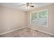 Bedroom features neutral carpeting, a ceiling fan, and a window with blinds at 6797 Braswell Mountain Rd, Rockmart, GA 30153