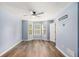 Spacious bedroom featuring a bay window, ceiling fan, and wood-look flooring at 6797 Braswell Mountain Rd, Rockmart, GA 30153