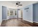 Bedroom with bay windows, hardwood floors, and bright blue walls at 6797 Braswell Mountain Rd, Rockmart, GA 30153