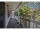 Charming front porch featuring a covered area with scenic views of greenery at 6797 Braswell Mountain Rd, Rockmart, GA 30153